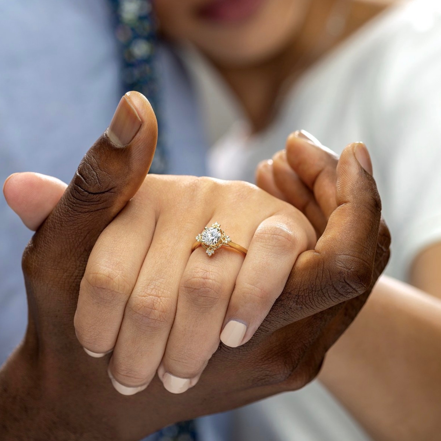 Buchkosky Jewlers couple holding hands and ring on finger